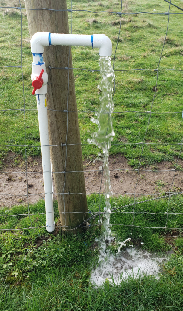 Water flowing out of bucket filling station 