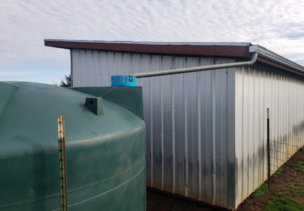 Rainwater collection system off of shelter roof into tanks