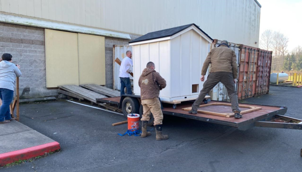 It took a crew of five to load the coop onto the trailer
